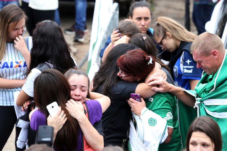 Fans of Chapecoense soccer team react.