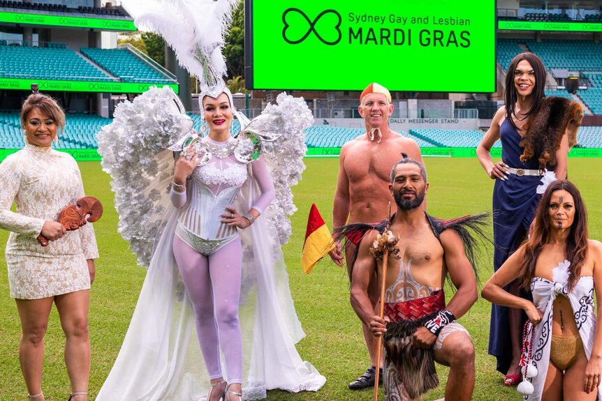 A group of people in costume stand in the middle of the SCG