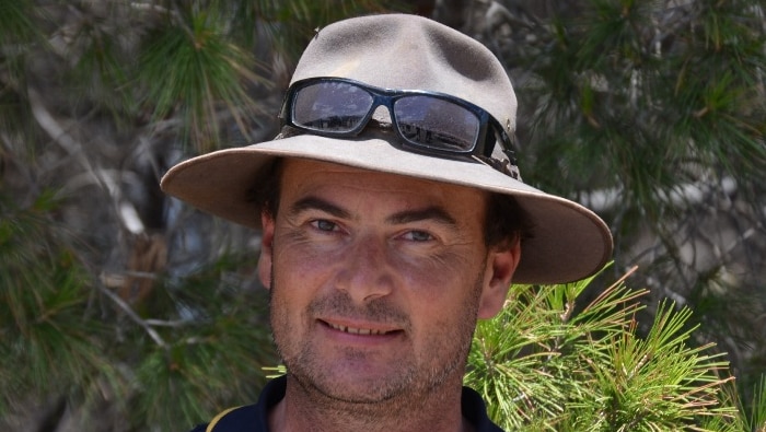 Wimmera farmer Paul Oxbrow with a broadbrim hat and sunglasses and blue t-shirt