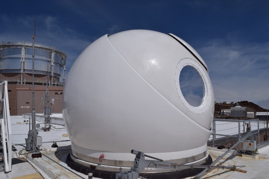 A smooth metal white spherical telescope dome