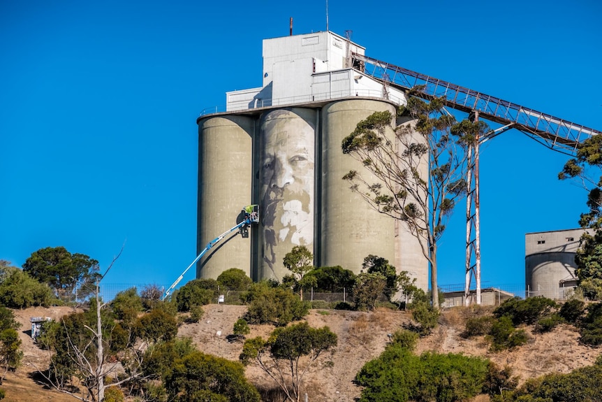 Silo with man's portrait half finished