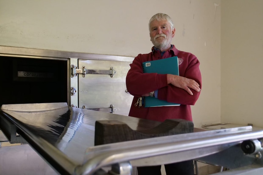President of Friends of J Ward Society, John Mawson stands in the Aradale Morgue