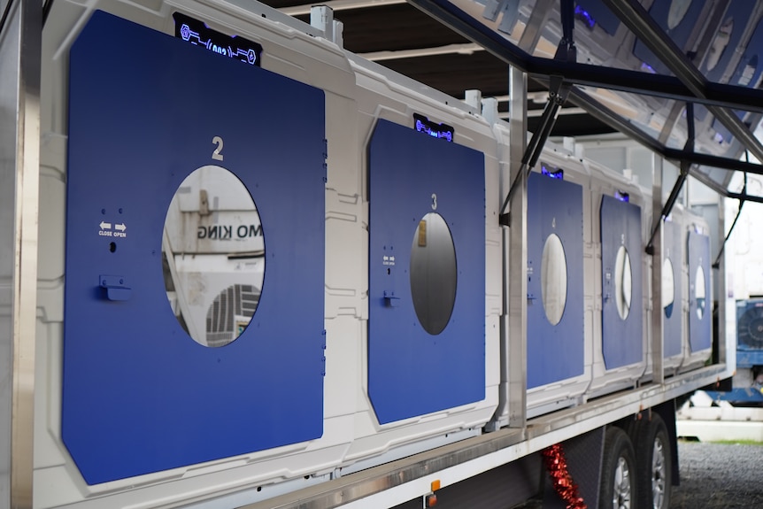 A row of pods inside a trailer.