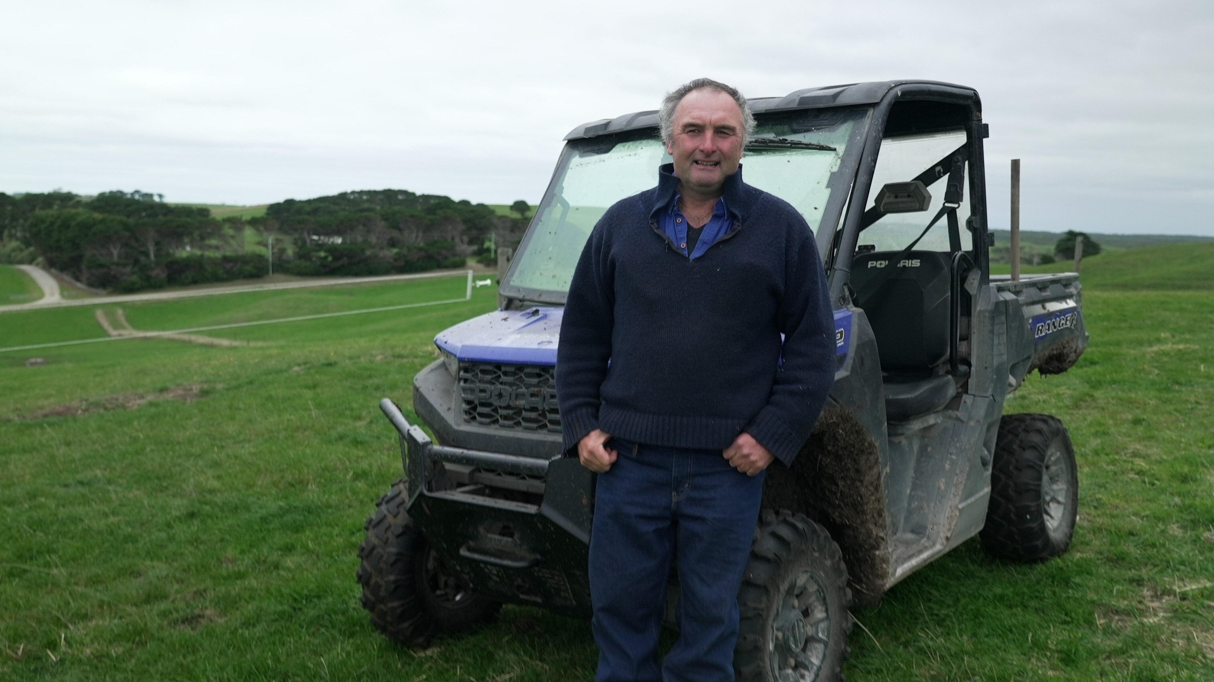 A man standing in front of a buggy