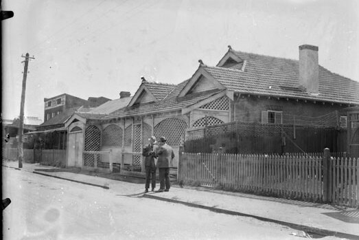 Black and white photo of house and street