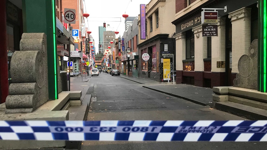 Police tape blocks entry to Little Bourke Street where a police found a woman's body.
