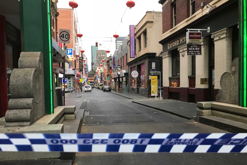 Police tape blocks entry to Little Bourke Street where a police found a woman's body.