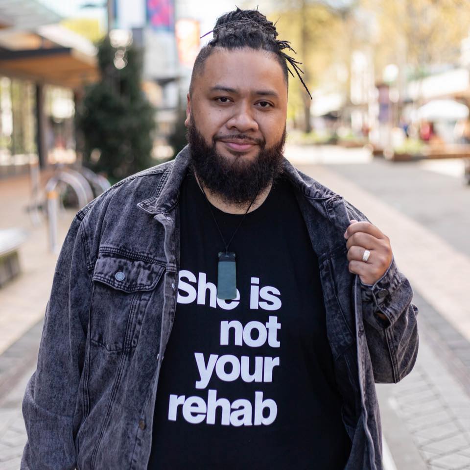 A man wearing a denim jacket.