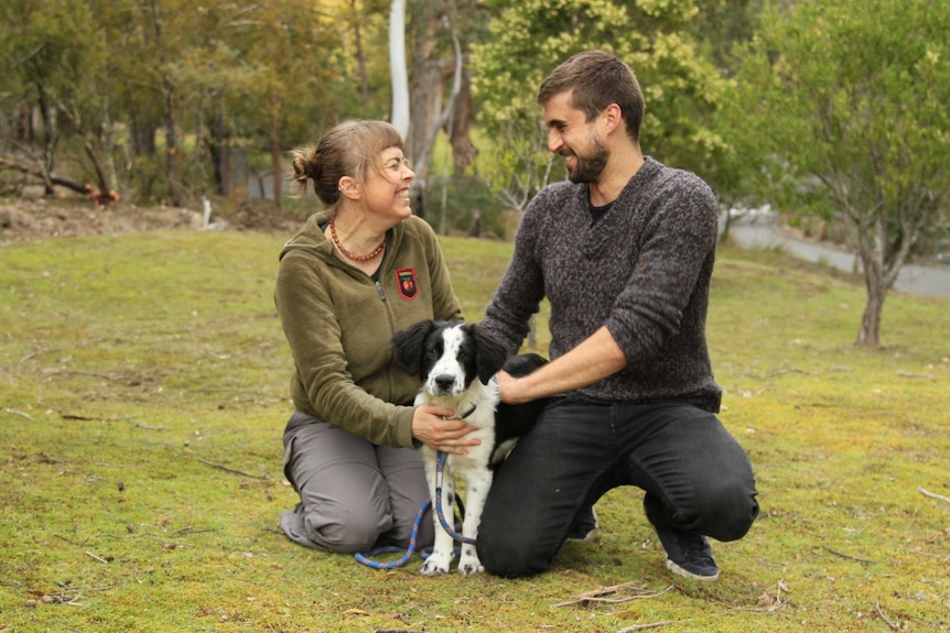 Dog trainer Nicole Gill (L) and conservation biologist Dejan Stojanovic with Zorro the sniffer dog.