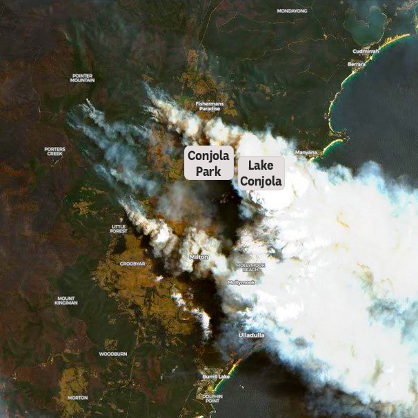 A satellite image of the Conjola area in NSW, showing thick clouds of smoke extending from inland national parks to the ocean.