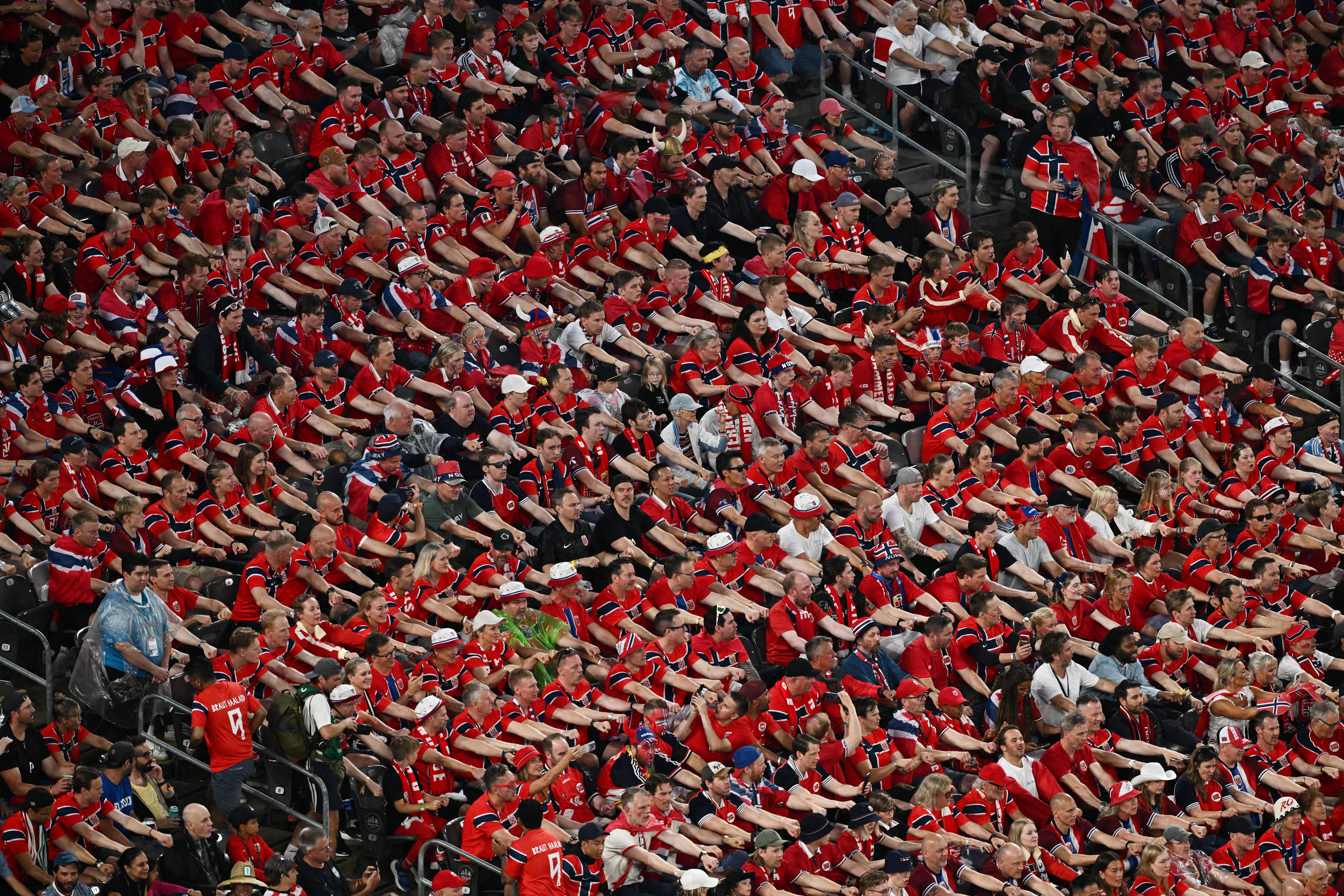 Thousands of Norway fans doing the Viking row at the World Cup stadium