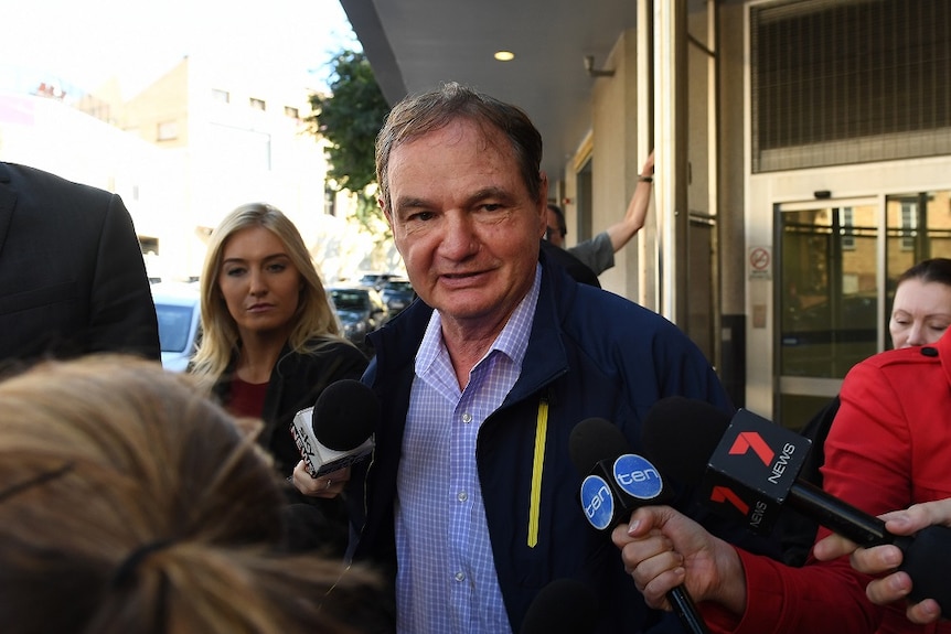 Former Ipswich mayor Paul Pisasale leaves the police watch house in Brisbane