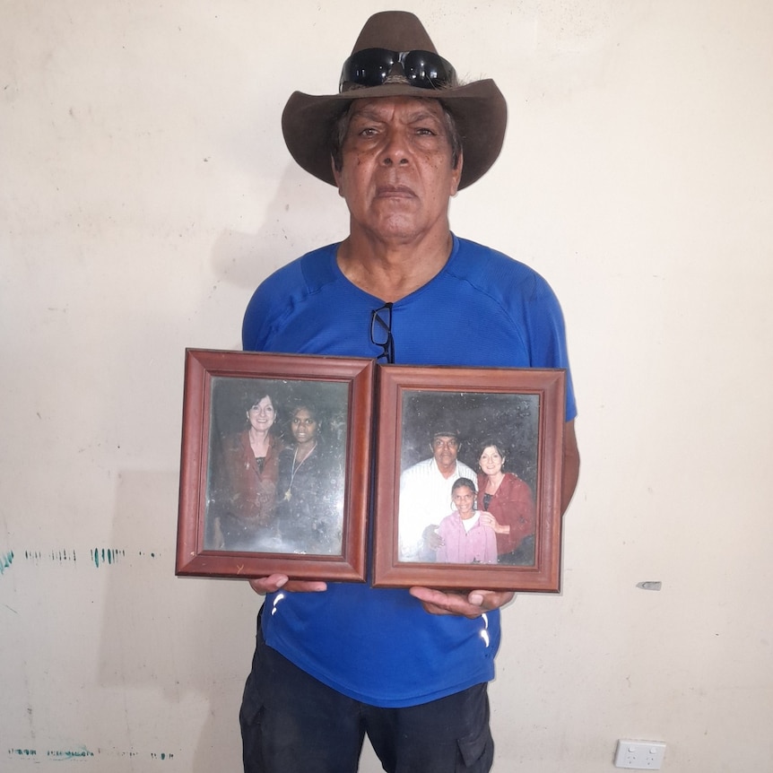 Peter Parlow with photos he recovered from the flood