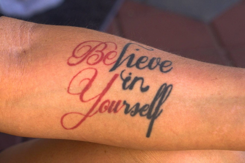 A tattoo saying believe in yourself
