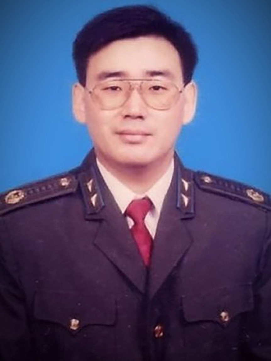 A young Chinese man in uniform.