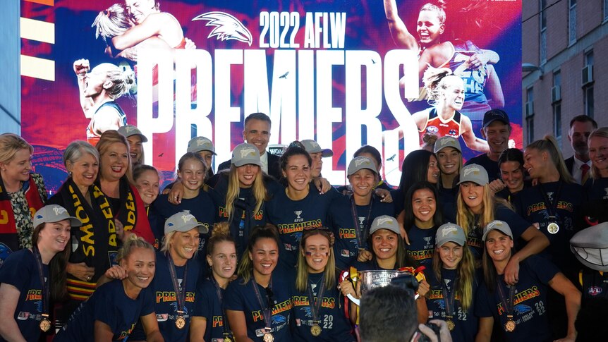 Adelaide Crows AFLW players with the premiership cup.