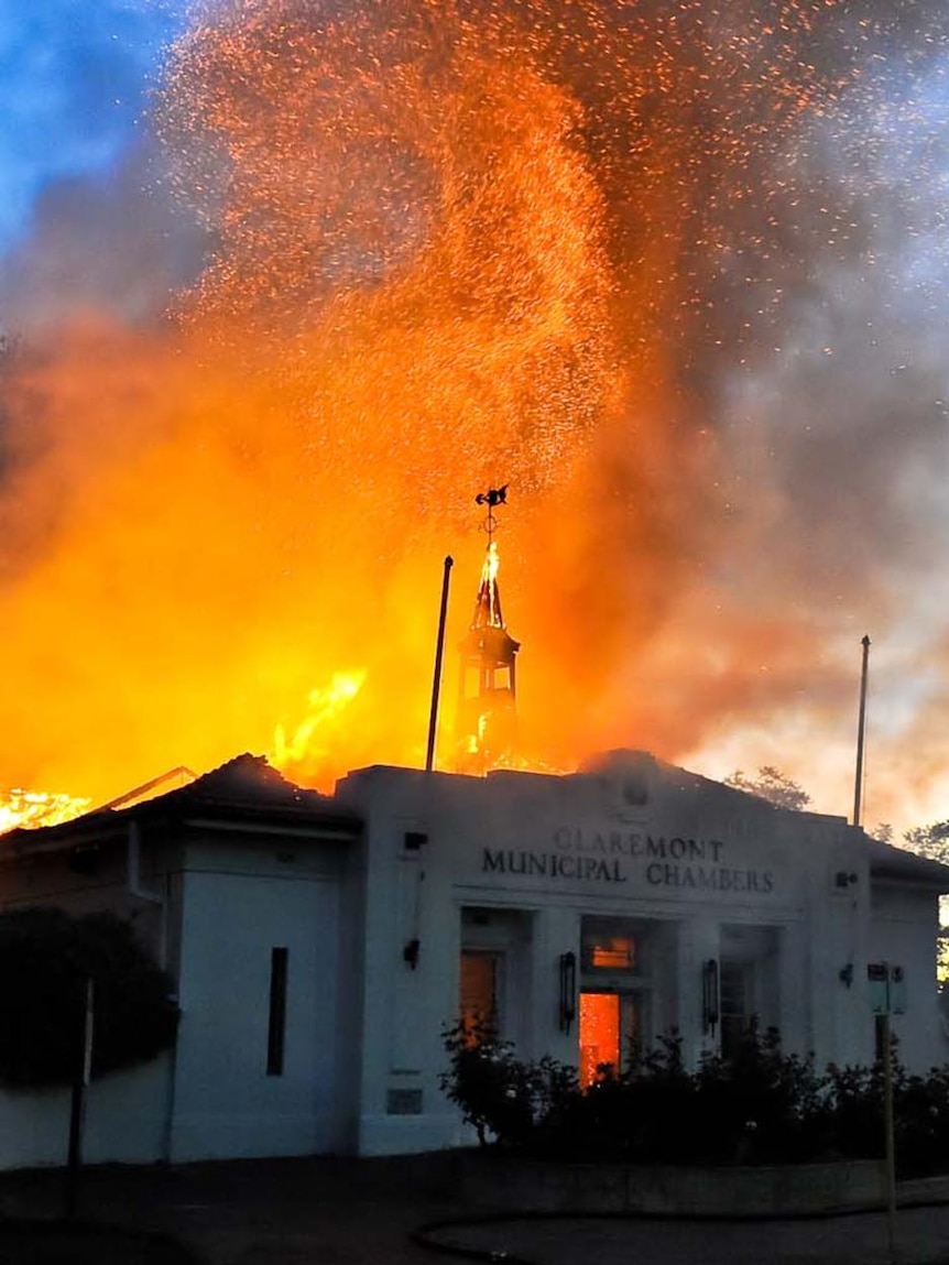 Flames and sparks rise from the Claremont Council chambers