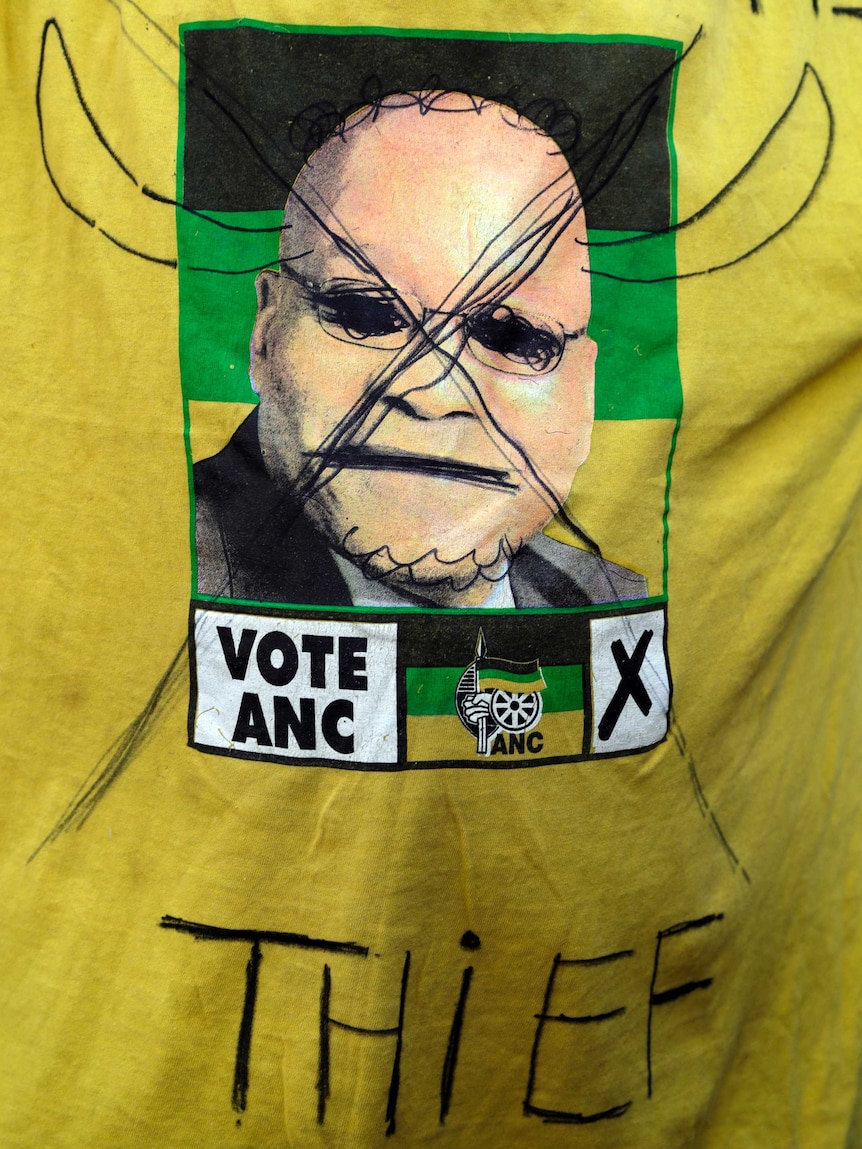 Yellow ANC shirt with a defaced picture of Jacob Zuma and the word Thief underneath