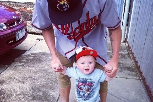 Jayden Sheridan helping his son walk when he was a baby.