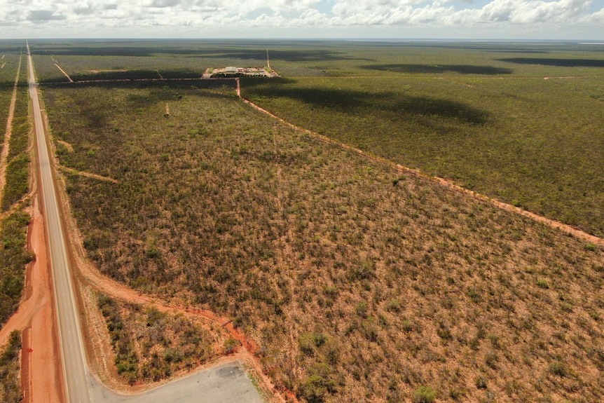 A drone shot of road and bush scrub
