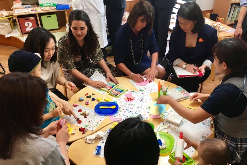 Karen Pence engages in an art therapy session at a local hospital in Tokyo during her husband's tour of Asia.