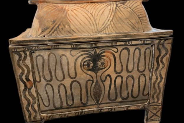 A small ceremonial chest decorated with artwork .