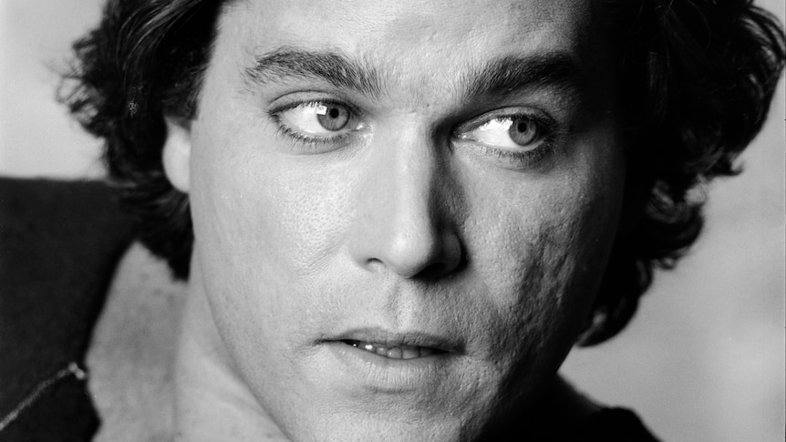 A black and white headshot of a young Ray Liotta