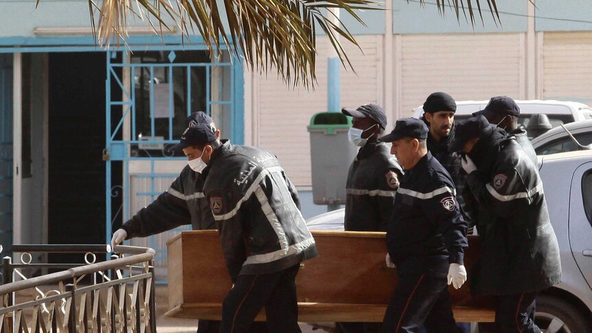 Rescue workers carry the coffin of one of the hostages killed during the Algerian gas plant hostage crisis.