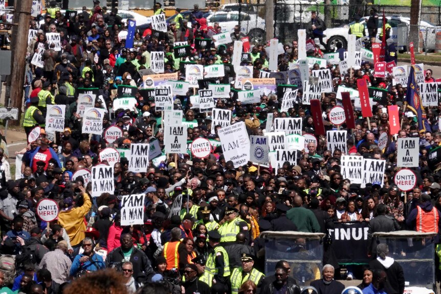 People march in an I AM 2018 March and Rally.