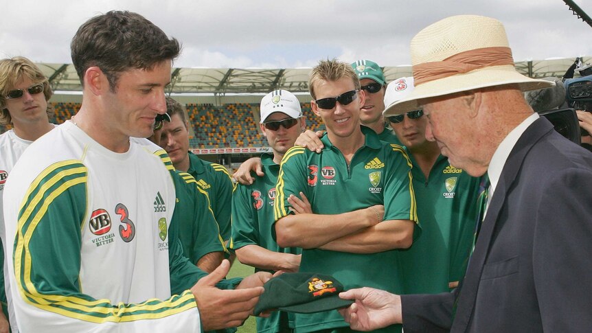Proud moment ... Michael Hussey is presented with his Baggy Green Cap by Bill Brown before his first Test in 2005