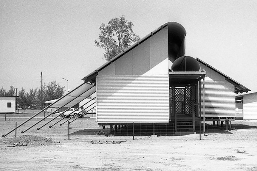 A black-and-white photo of a tropical style of housing.