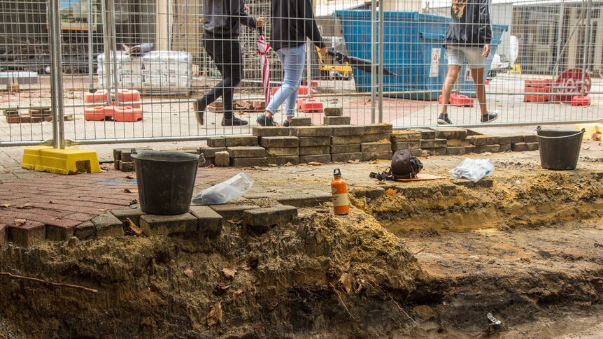 Archaeologists are uncovering layers of past buildings at the front of the old council offices.