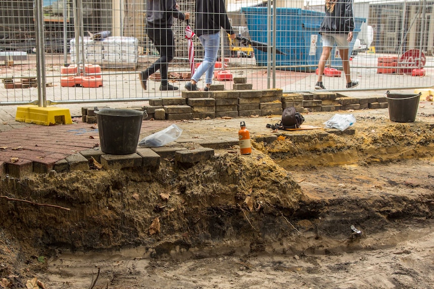 Archaeologists are uncovering layers of past buildings at the front of the old council offices.