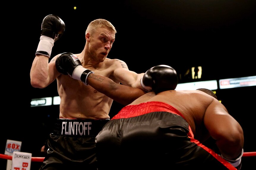 Andrew Flintoff (L) recovered from an early knock-down to beat Richard Dawson on points.