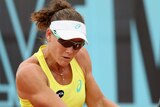 Stosur plays a backhand against Kerber