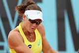 Stosur plays a backhand against Kerber