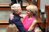 Julie Bishop and Kerryn Phelps embrace in Parliament