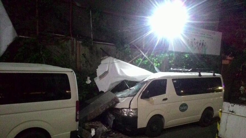 A car damaged by an earthquake in the Philippines.