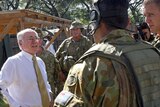 PM John Howard speaks to peacekeepers in Dili during a snap visit to East Timor.