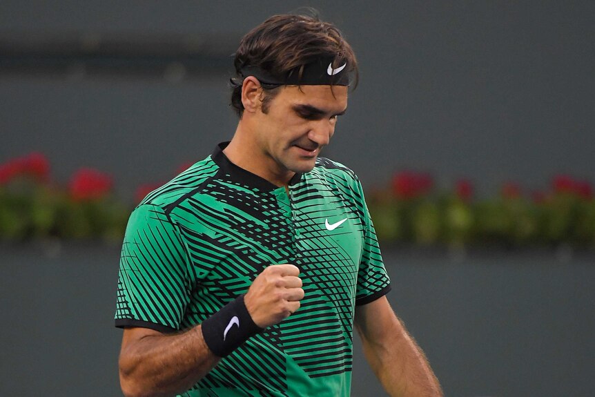 Roger Federer celebrates after beating Steve Johnson in straight sets in Indian Wells.