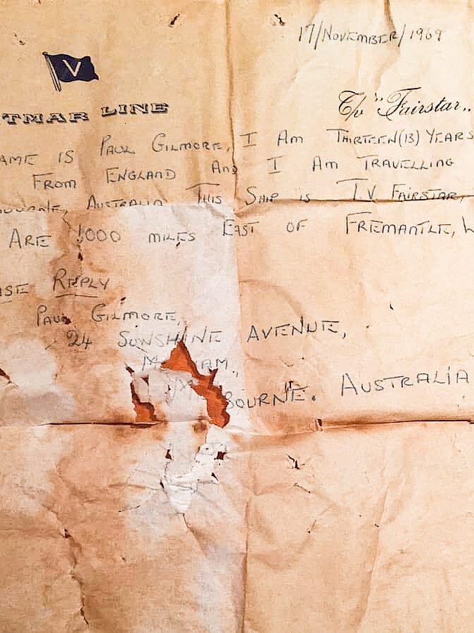 The letter which says "My name is Paul Gilmore, I am 13 years old, I am from England and I am travelling to Melbourne Australia"