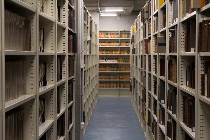 Rows of rare books in the archives of the State Library of NSW