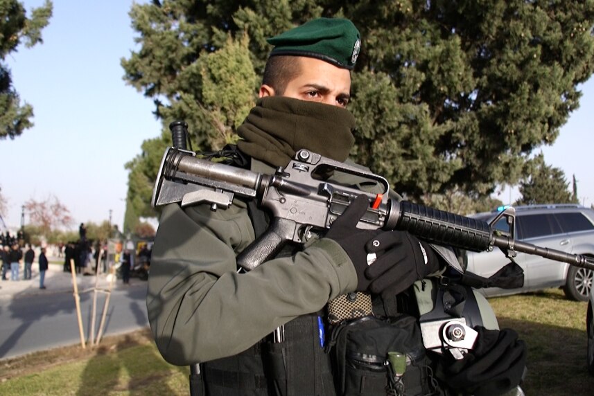 An Israeli solder stands guard at the scene.