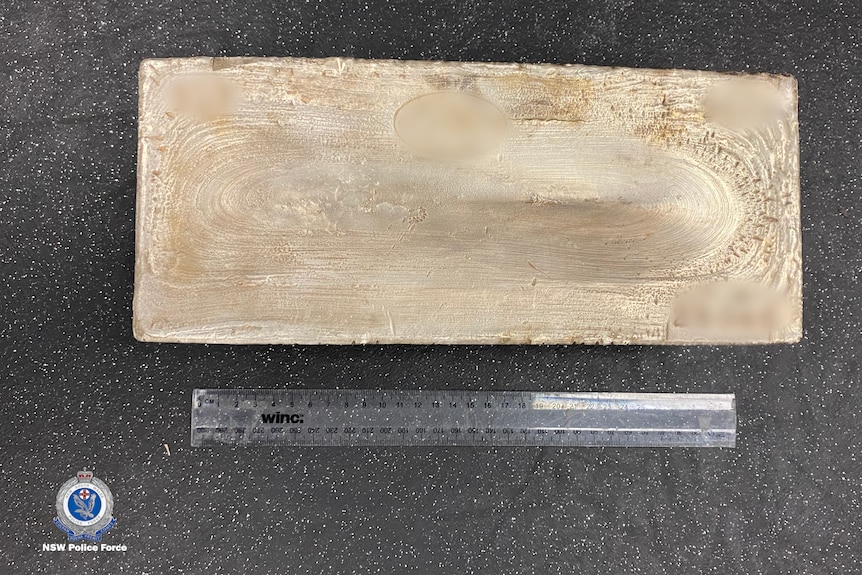 Silver ingot to scale against a 30cm ruler