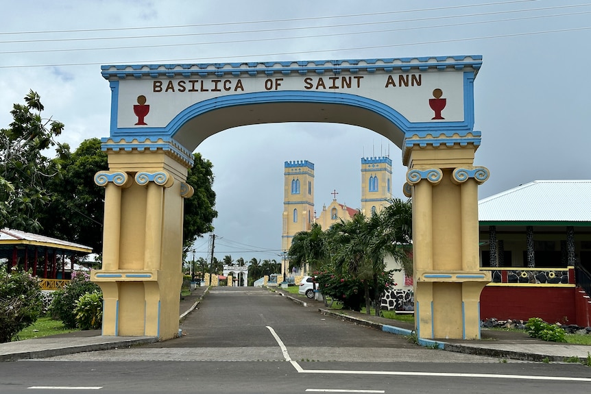 The yellow, white and blue archway at the entrance of the Basilica of Saint Ann in Leulumoega.