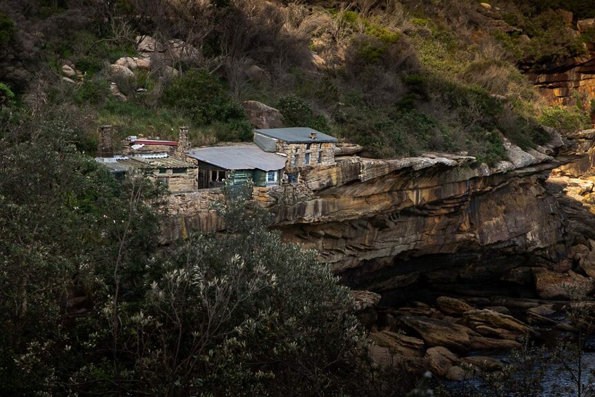 A row of huts on a cliff