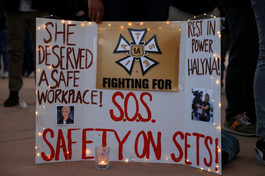 A sign calling for workplace safety at a vigil for cinematographer Halyna Hutchin