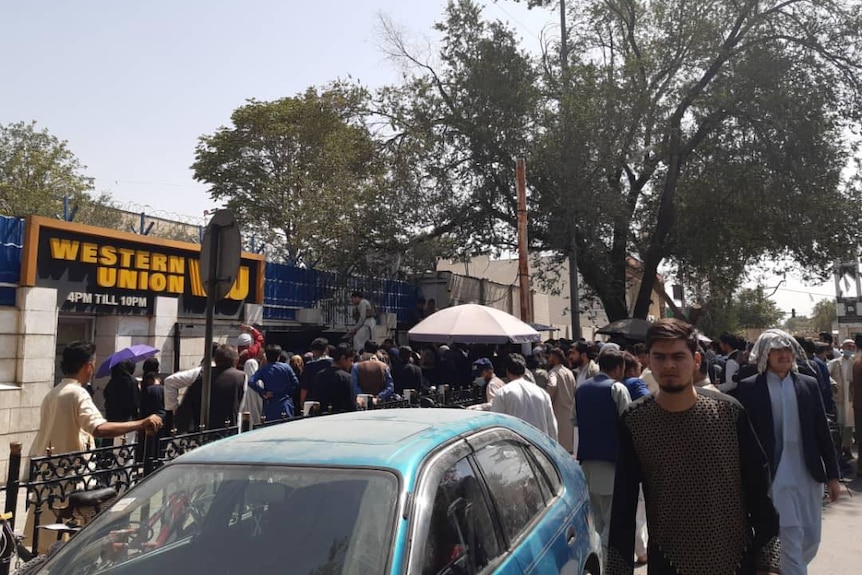 queue of people outside a building