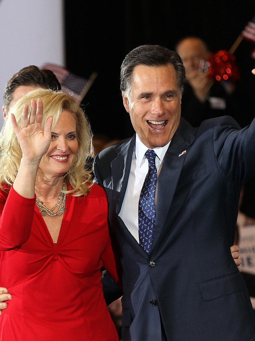 Republican presidential candidate and former Massachusetts governor Mitt Romney and his wife Ann wave to supporters