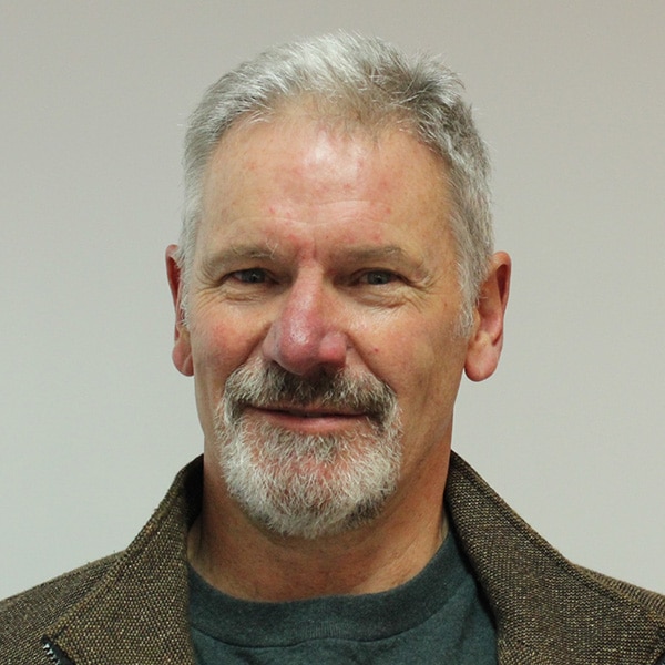Anthony Smith smiles in close-up photo.
